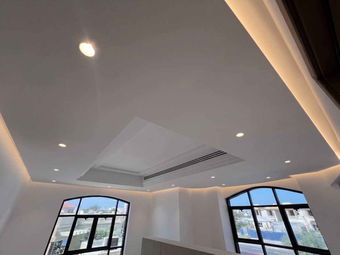 Arched forms carried through the ceiling