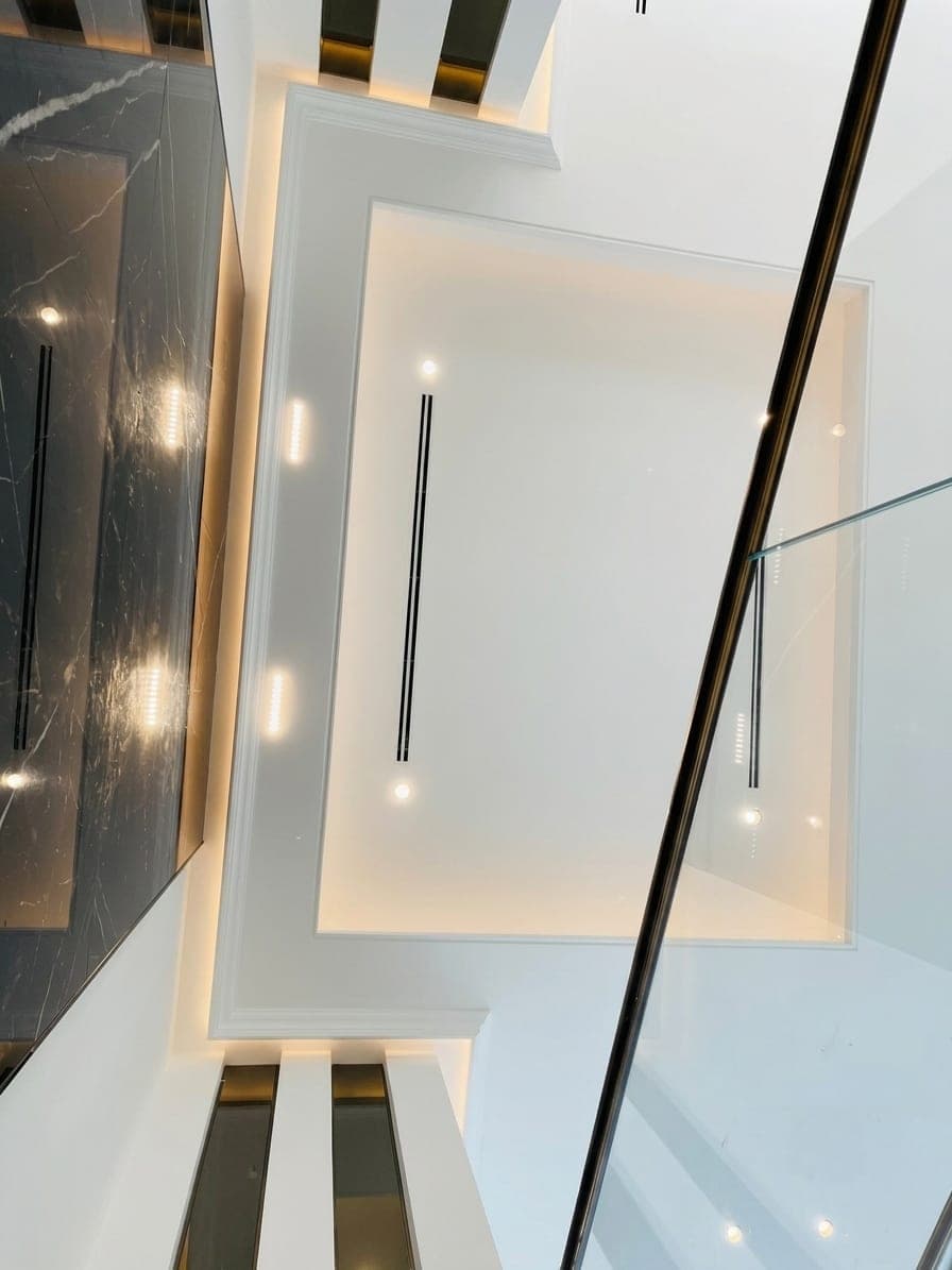 The marble void seen from above, with a gold balustrade