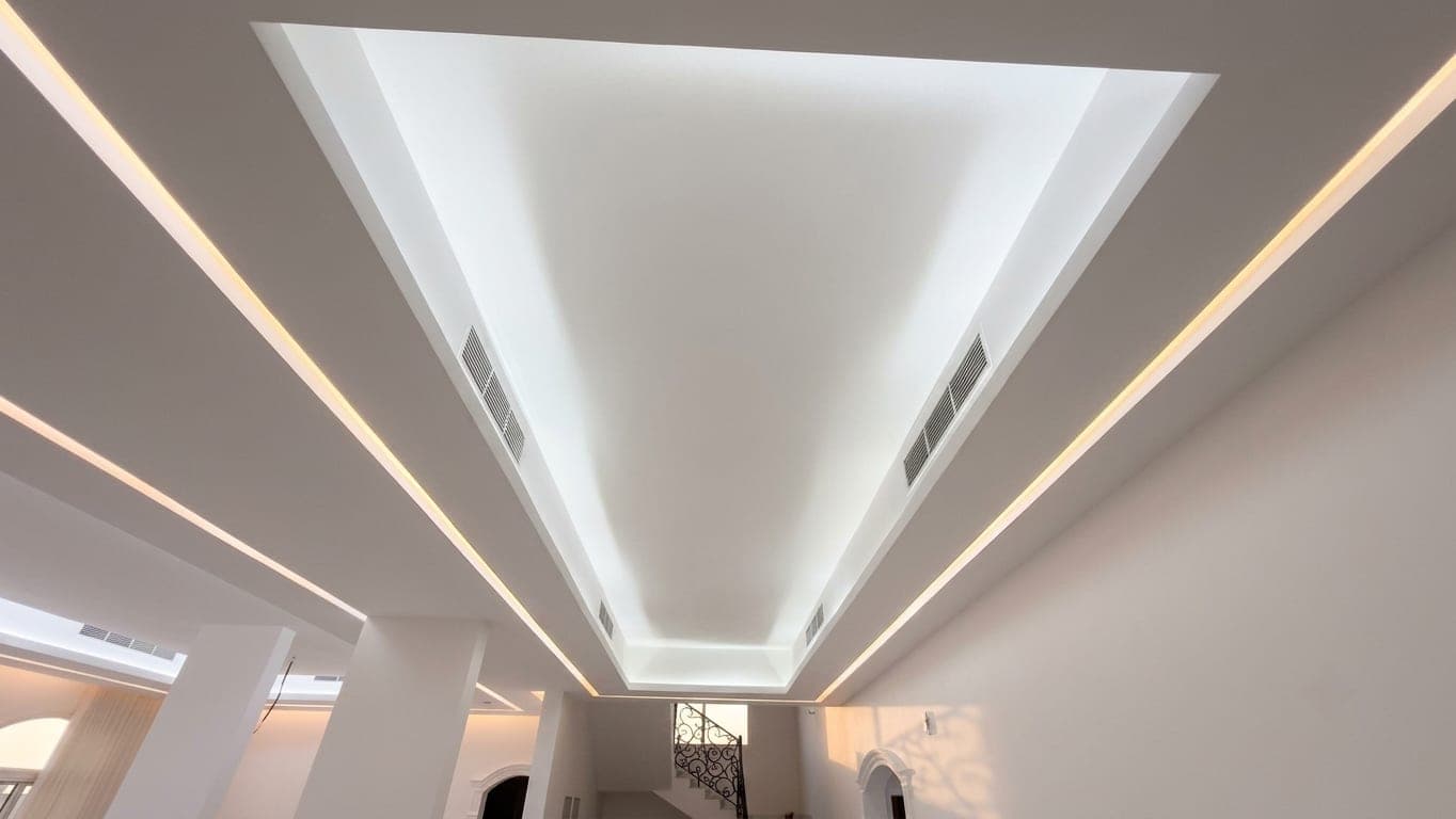 The geometric cove ceiling seen along the reception