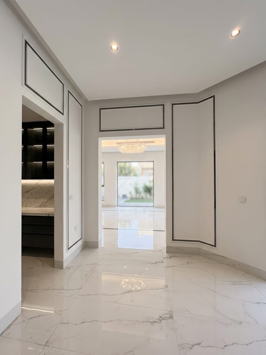 A gallery corridor in polished marble, opening to the garden