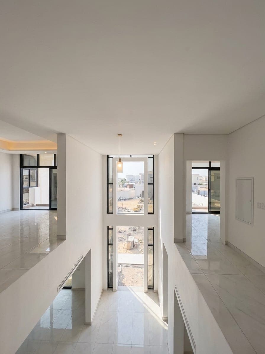 The upper gallery in polished marble, looking across the double-height void