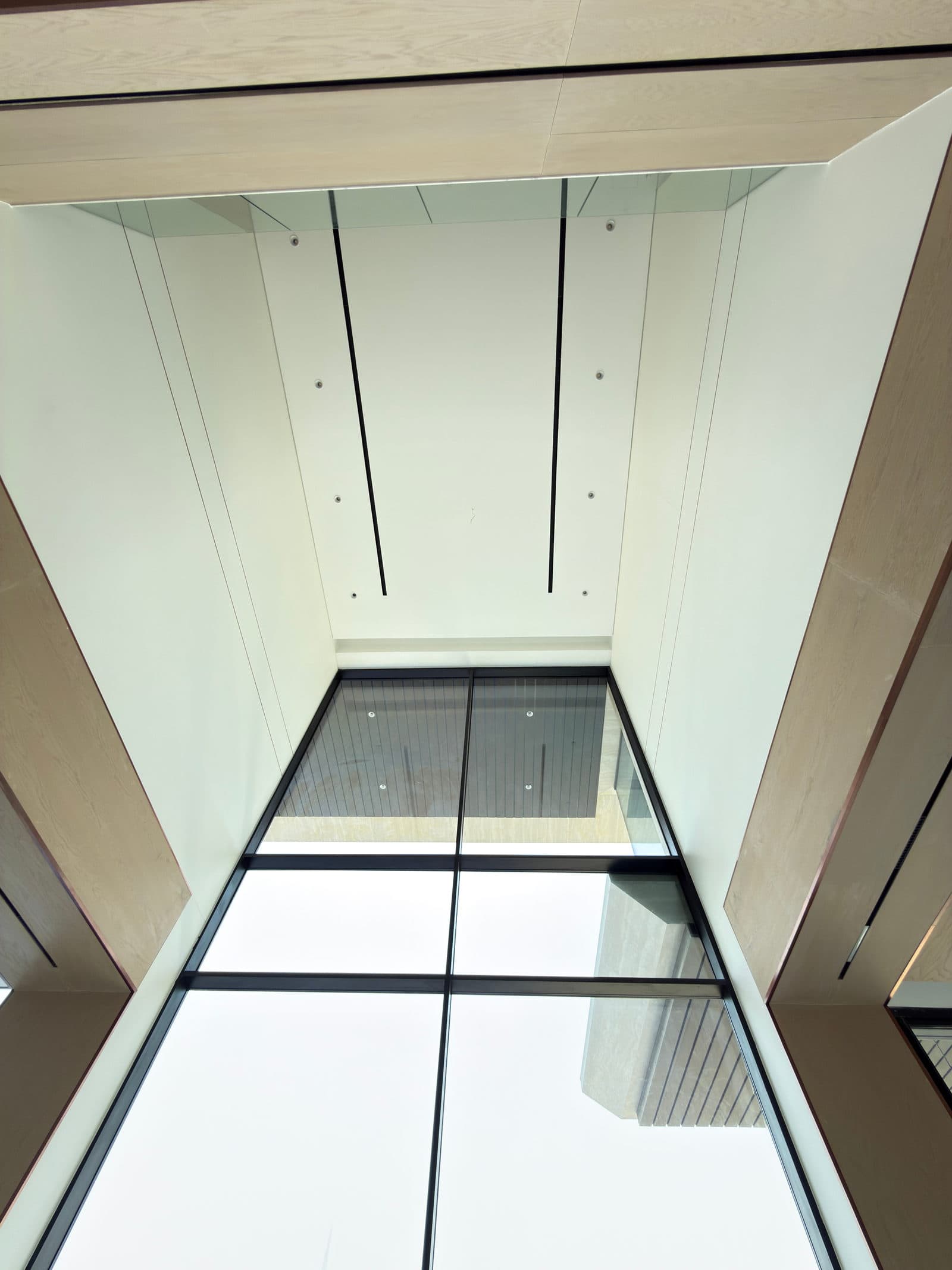A glazed floor panel looking down into the void below