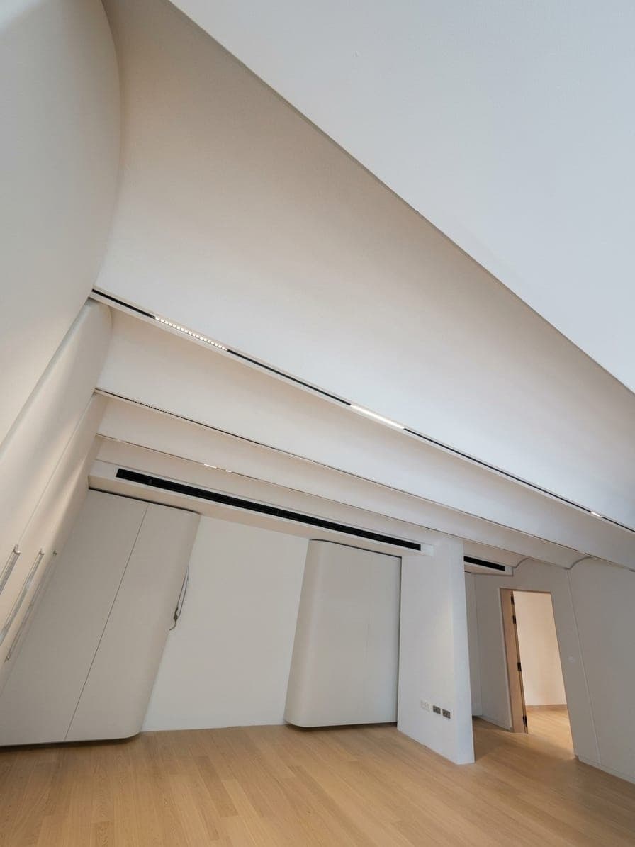 A dramatically angled vaulted ceiling above the space