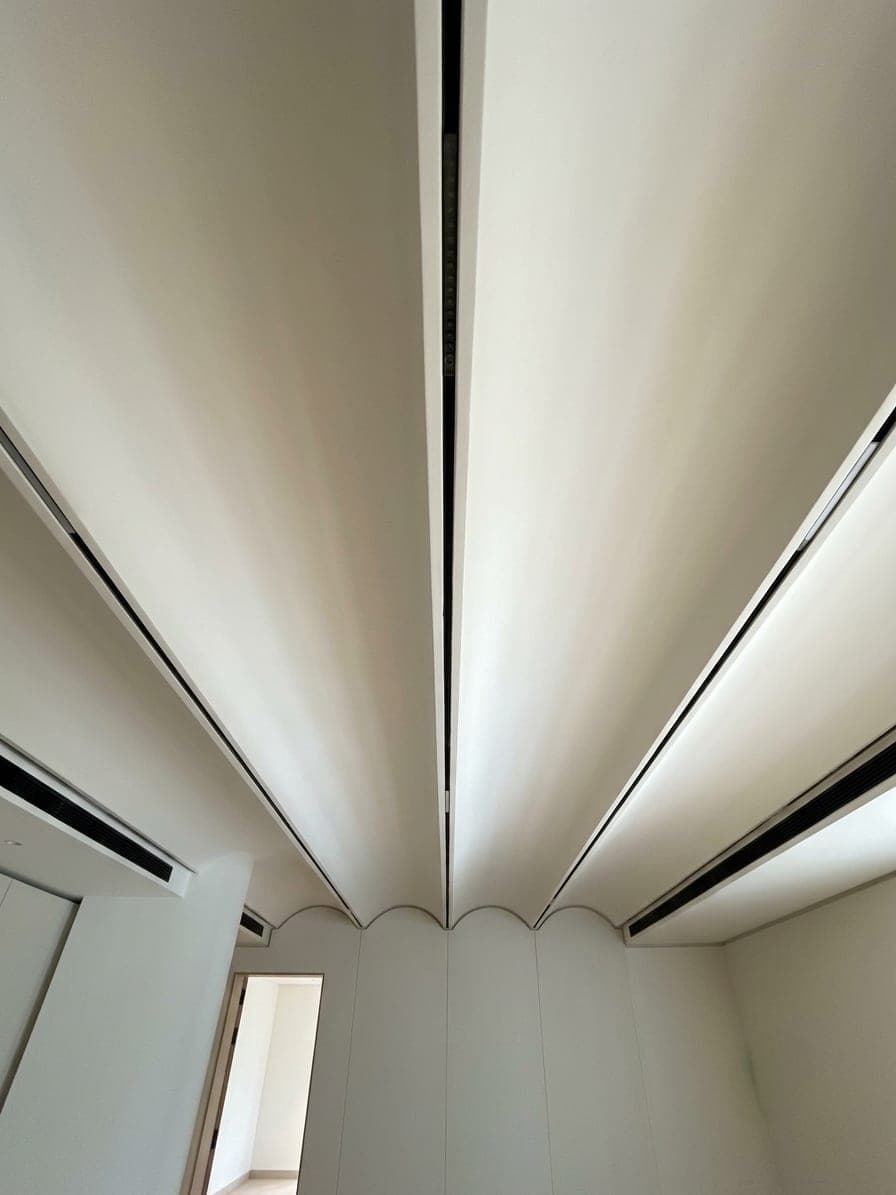 A scalloped, curved ceiling seen from below